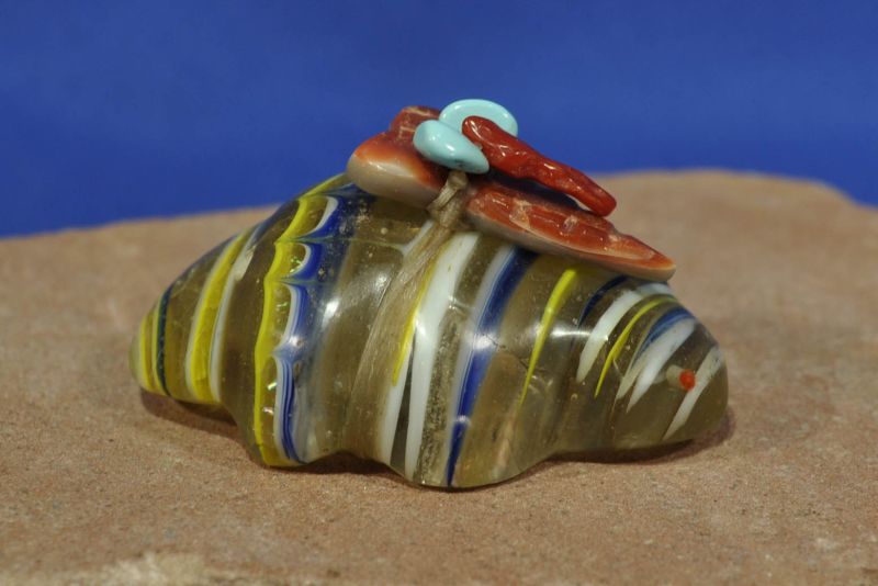 A unique Zuni Pueblo Indian fetish of a mole in glass with gift pack on back